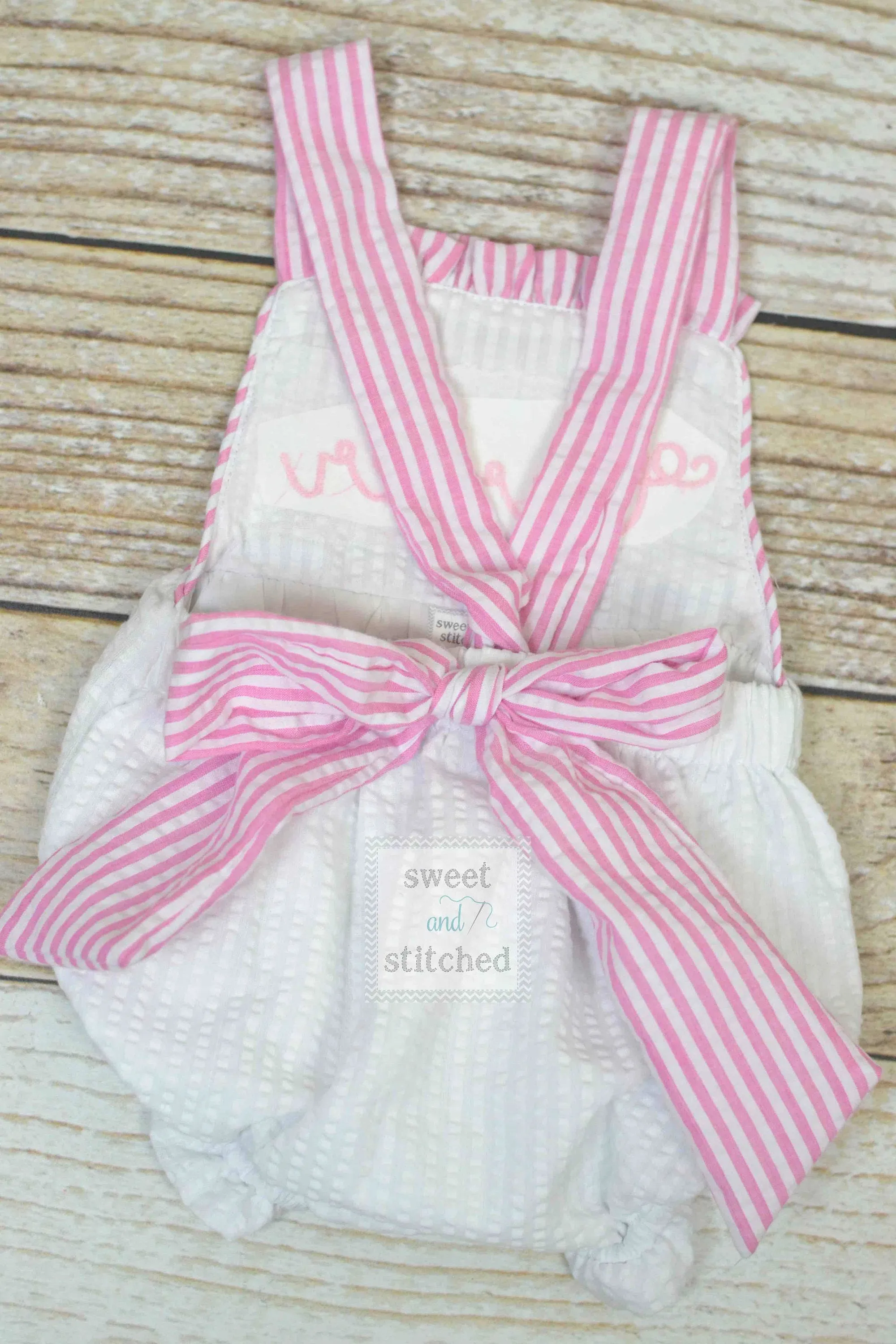 BLANK baby girl seersucker romper pink and white seersucker