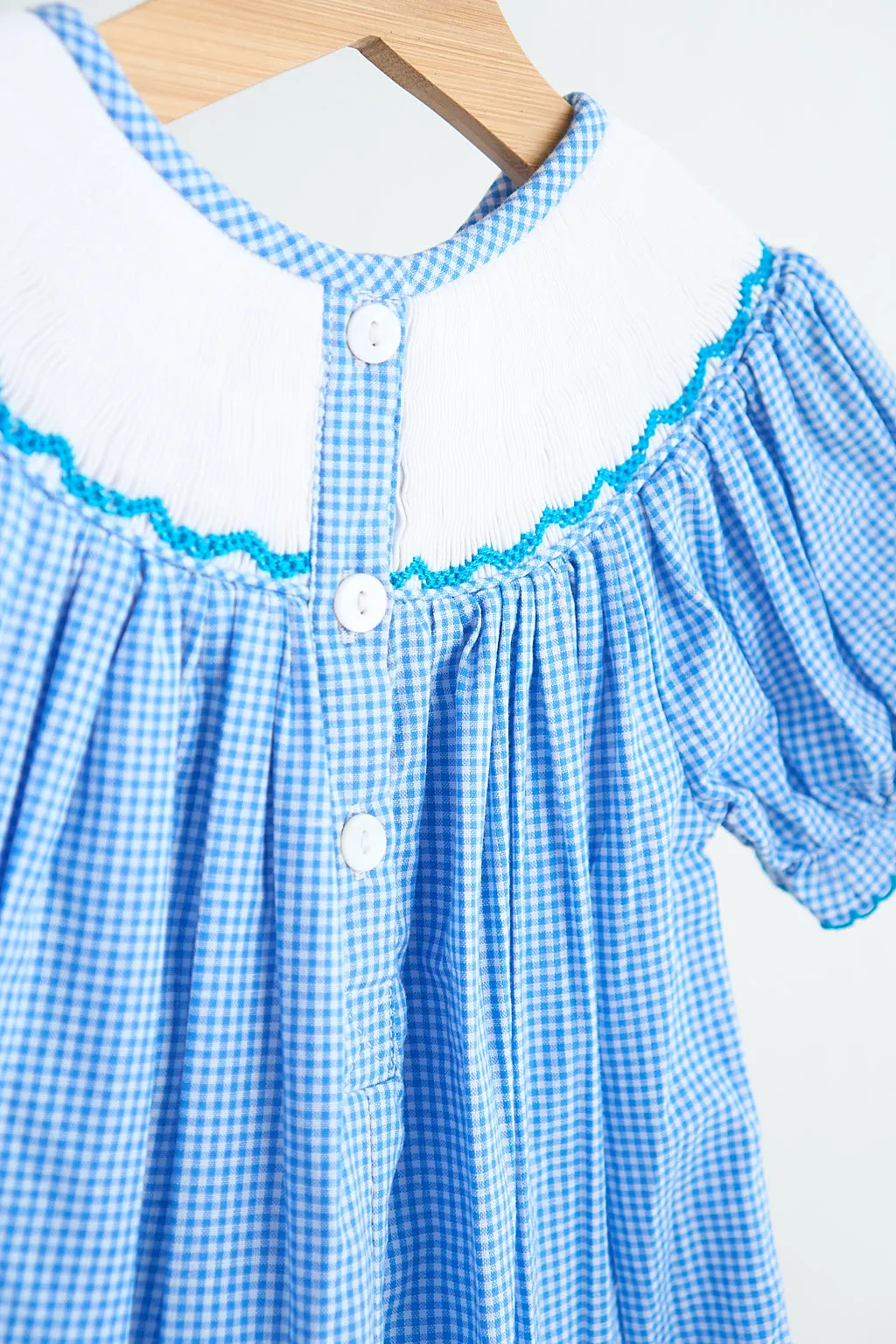 Blue snow princess hand smocked gingham girl romper