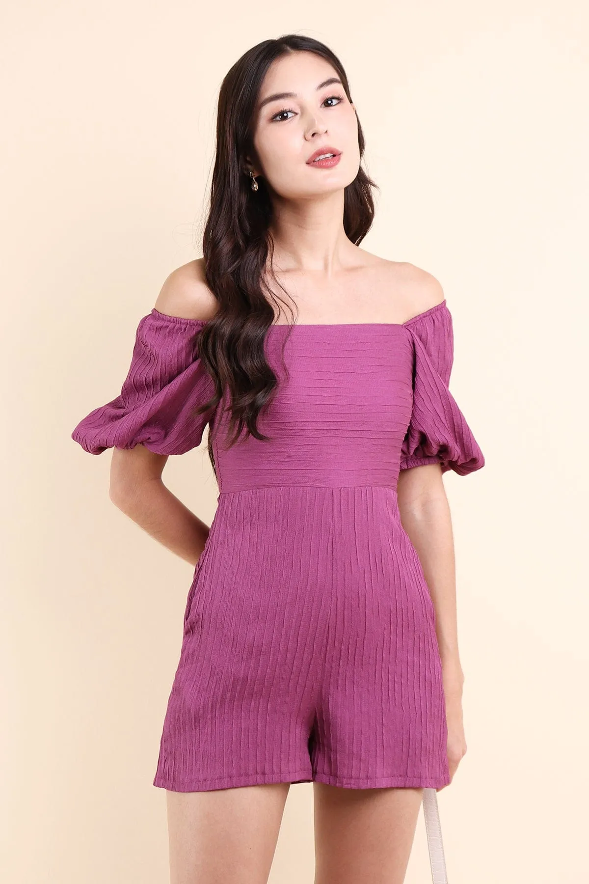 CAMDEN PUFF SLEEVE TEXTURED ROMPER IN ROSE MAGENTA