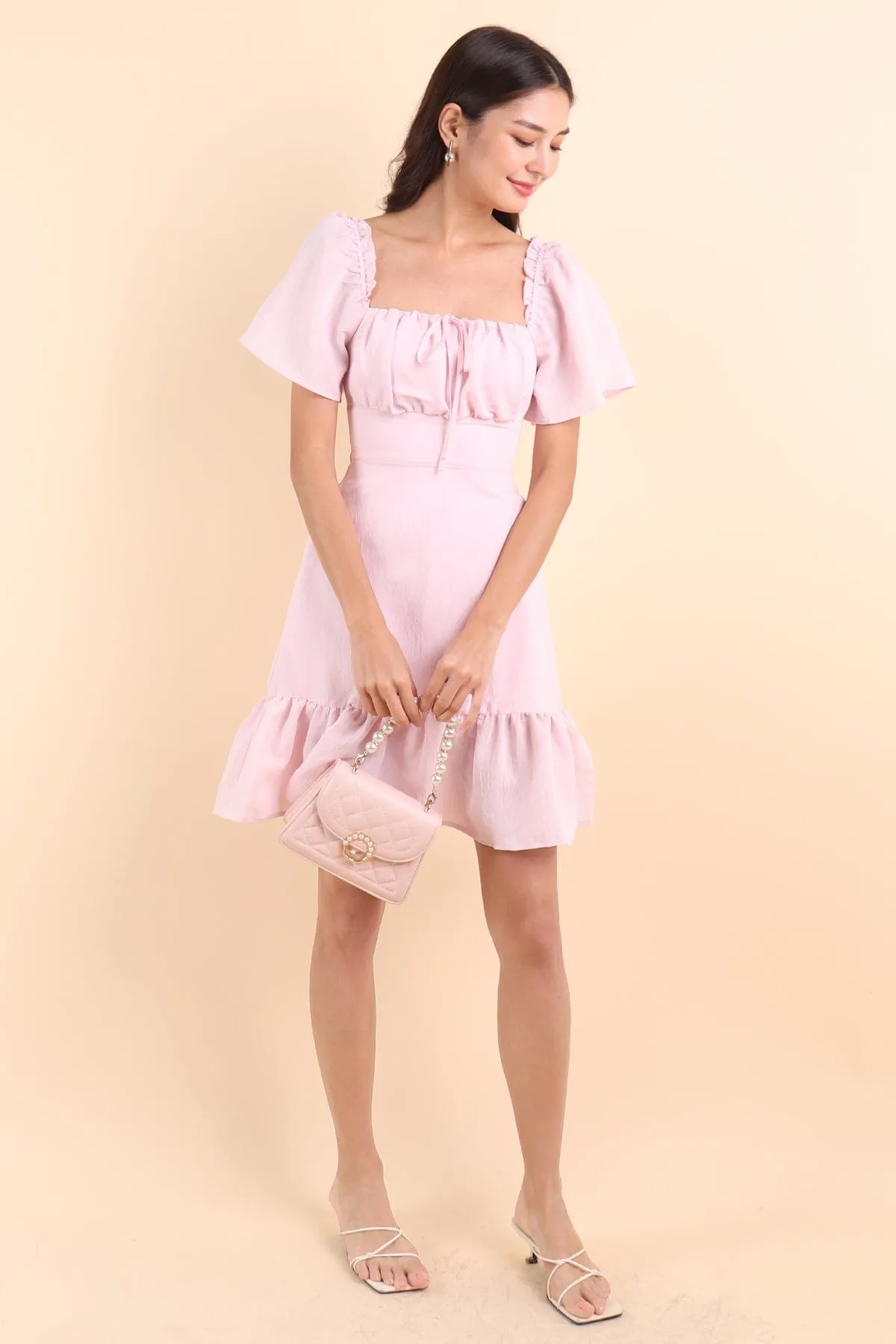 KHELSIE RUCHED FLUTTER SLEEVE ROMPER DRESS IN SWEET PINK