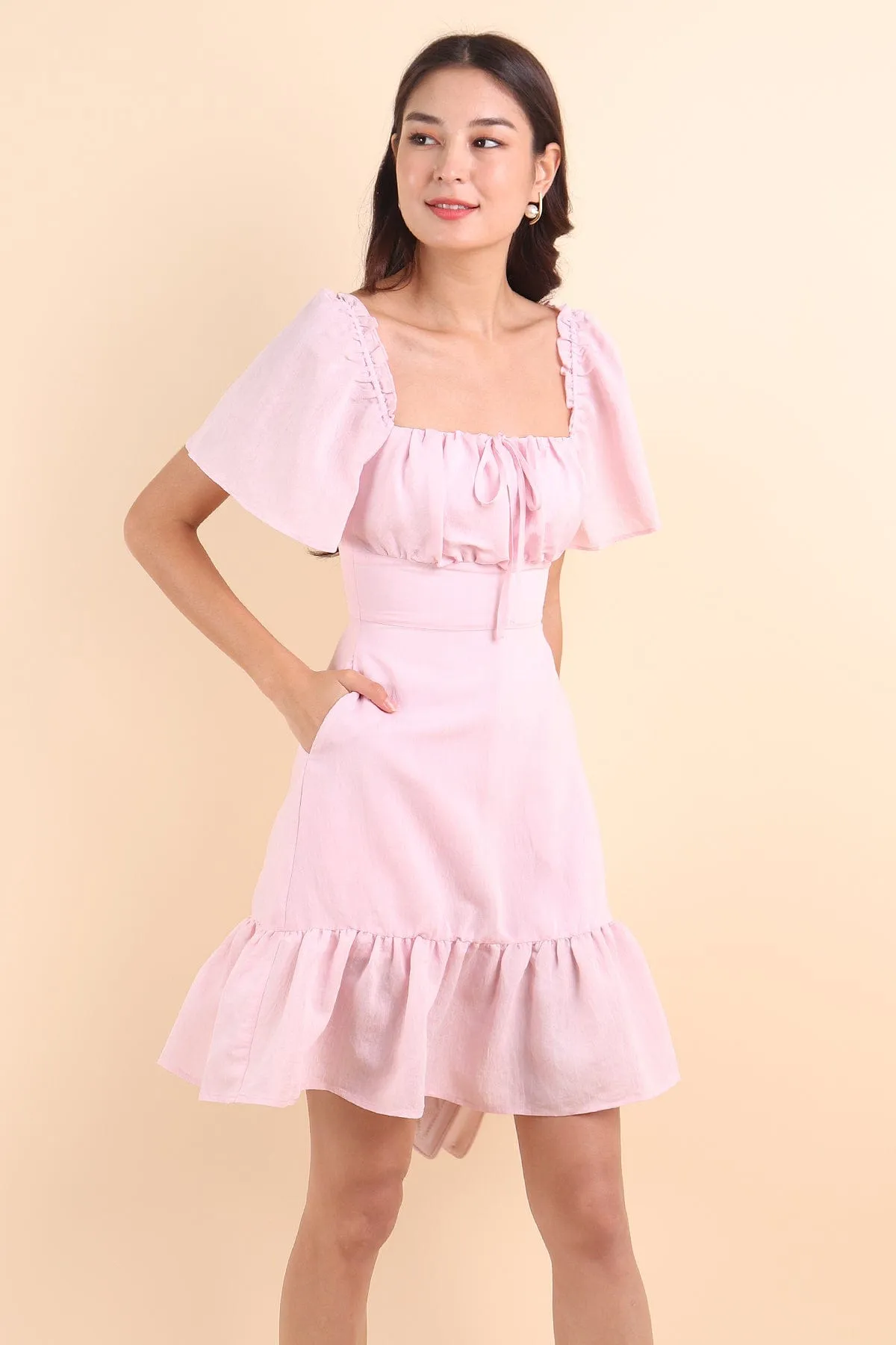 KHELSIE RUCHED FLUTTER SLEEVE ROMPER DRESS IN SWEET PINK