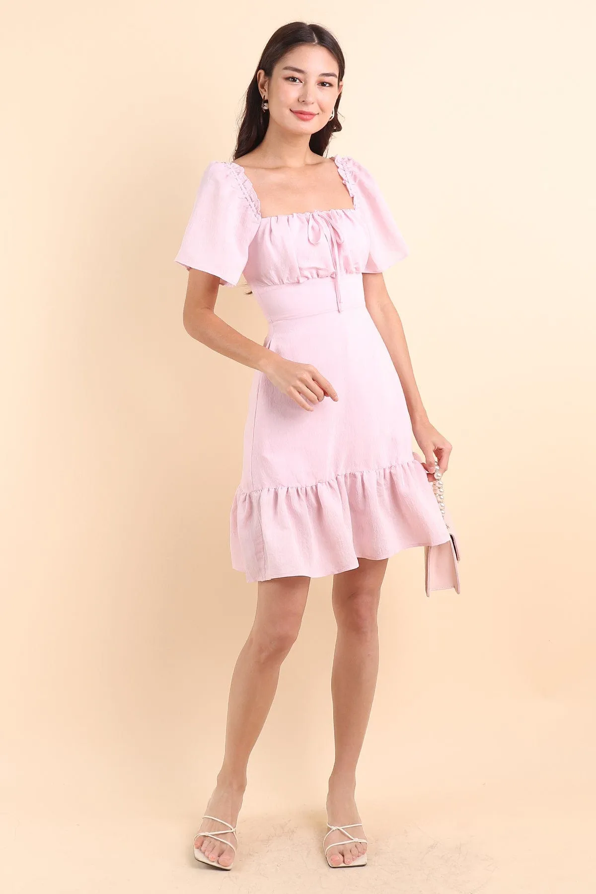 KHELSIE RUCHED FLUTTER SLEEVE ROMPER DRESS IN SWEET PINK