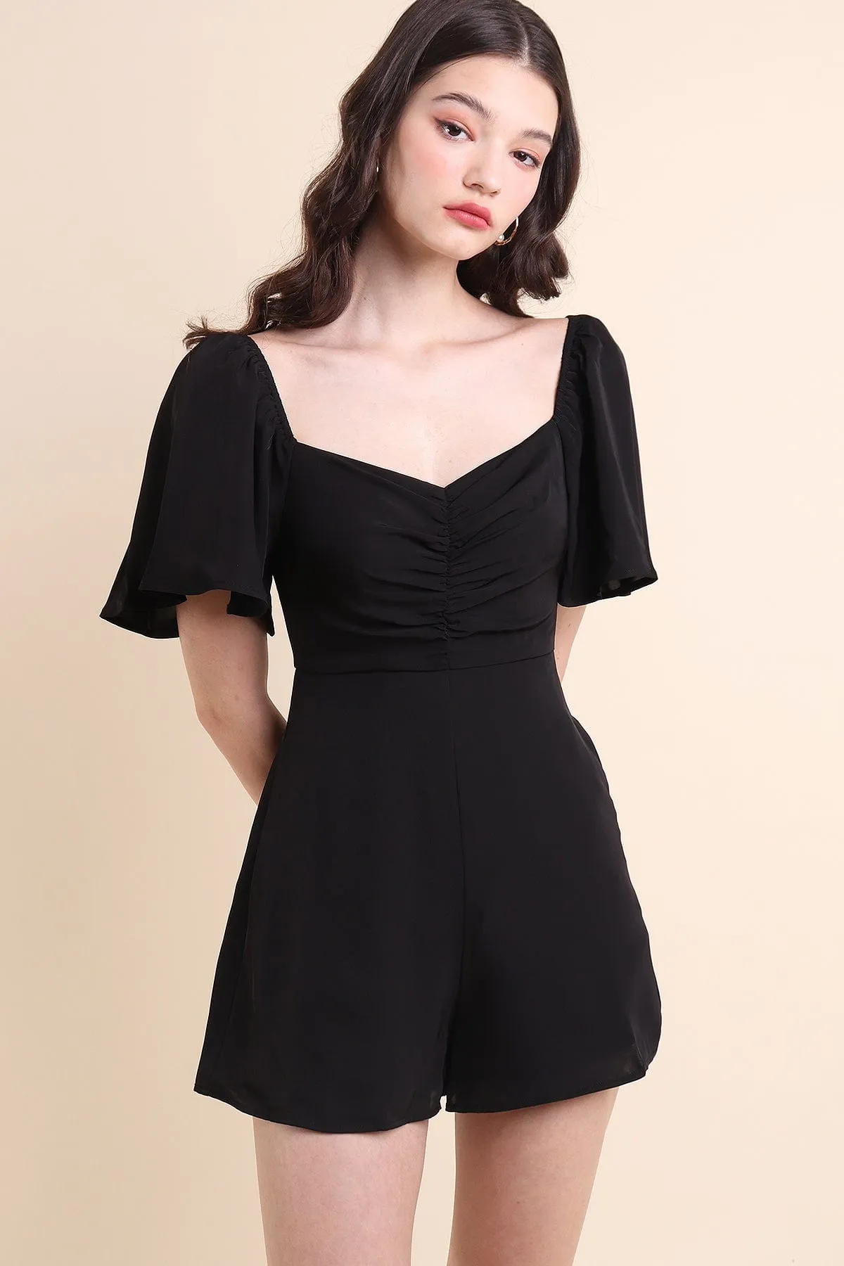 RESTOCKED** MEREDITH RUCHED ROMPER IN BLACK