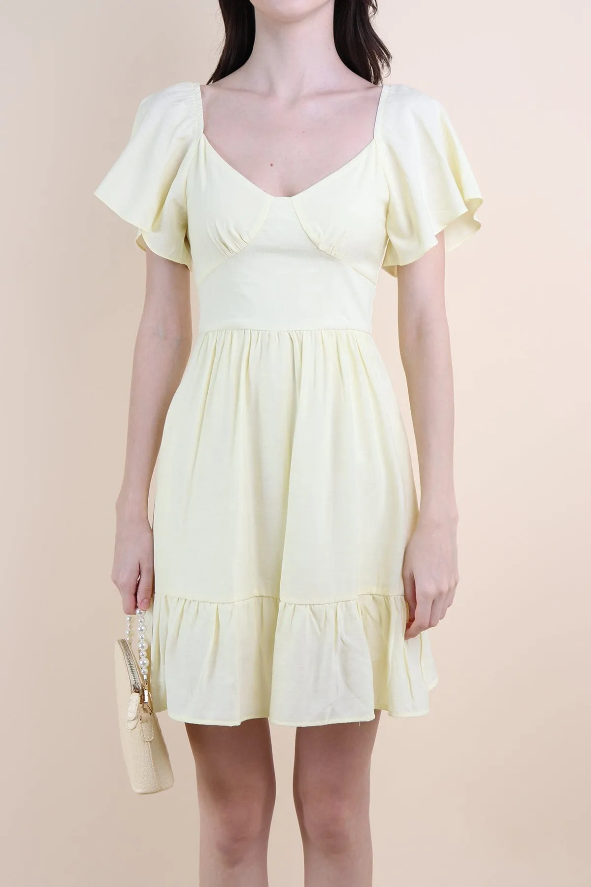 VENETIA ROMPER DRESS IN PALE DAFFODIL