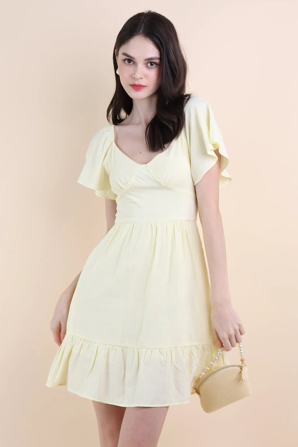 VENETIA ROMPER DRESS IN PALE DAFFODIL