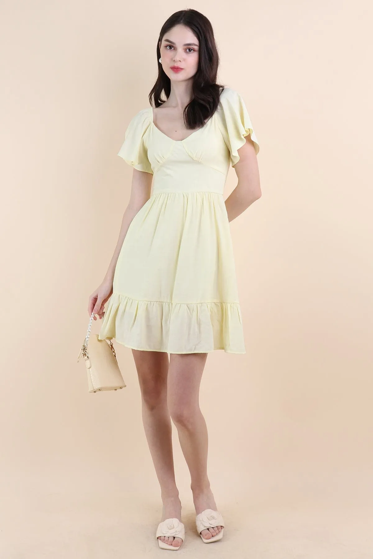 VENETIA ROMPER DRESS IN PALE DAFFODIL