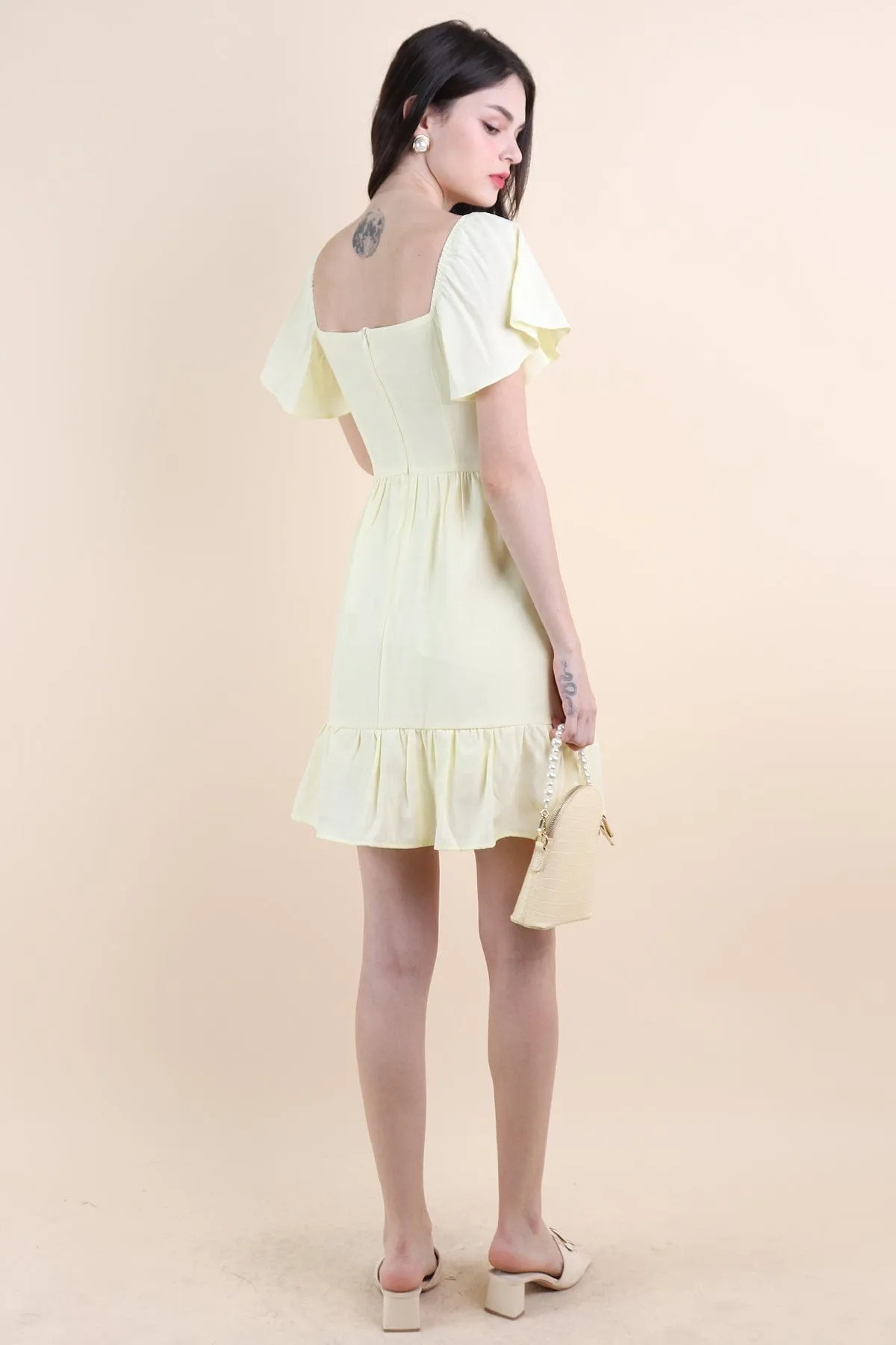 VENETIA ROMPER DRESS IN PALE DAFFODIL